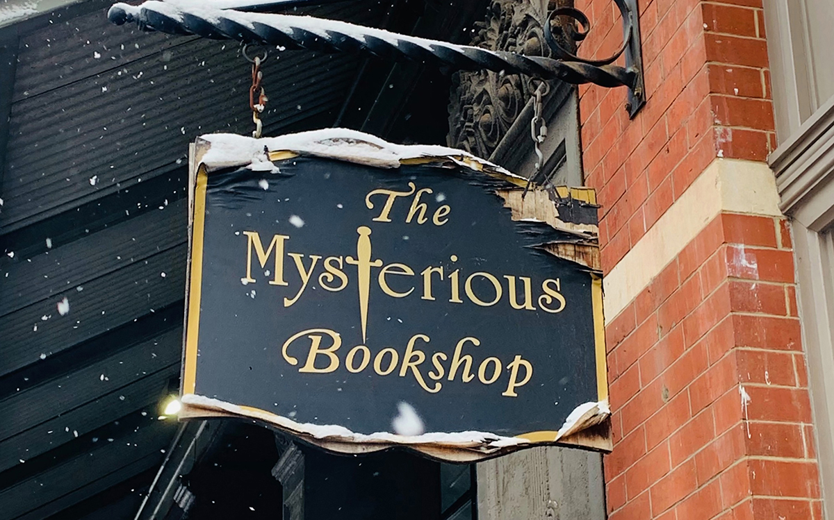 store sign outside at the front of The Mysterious Bookshop
